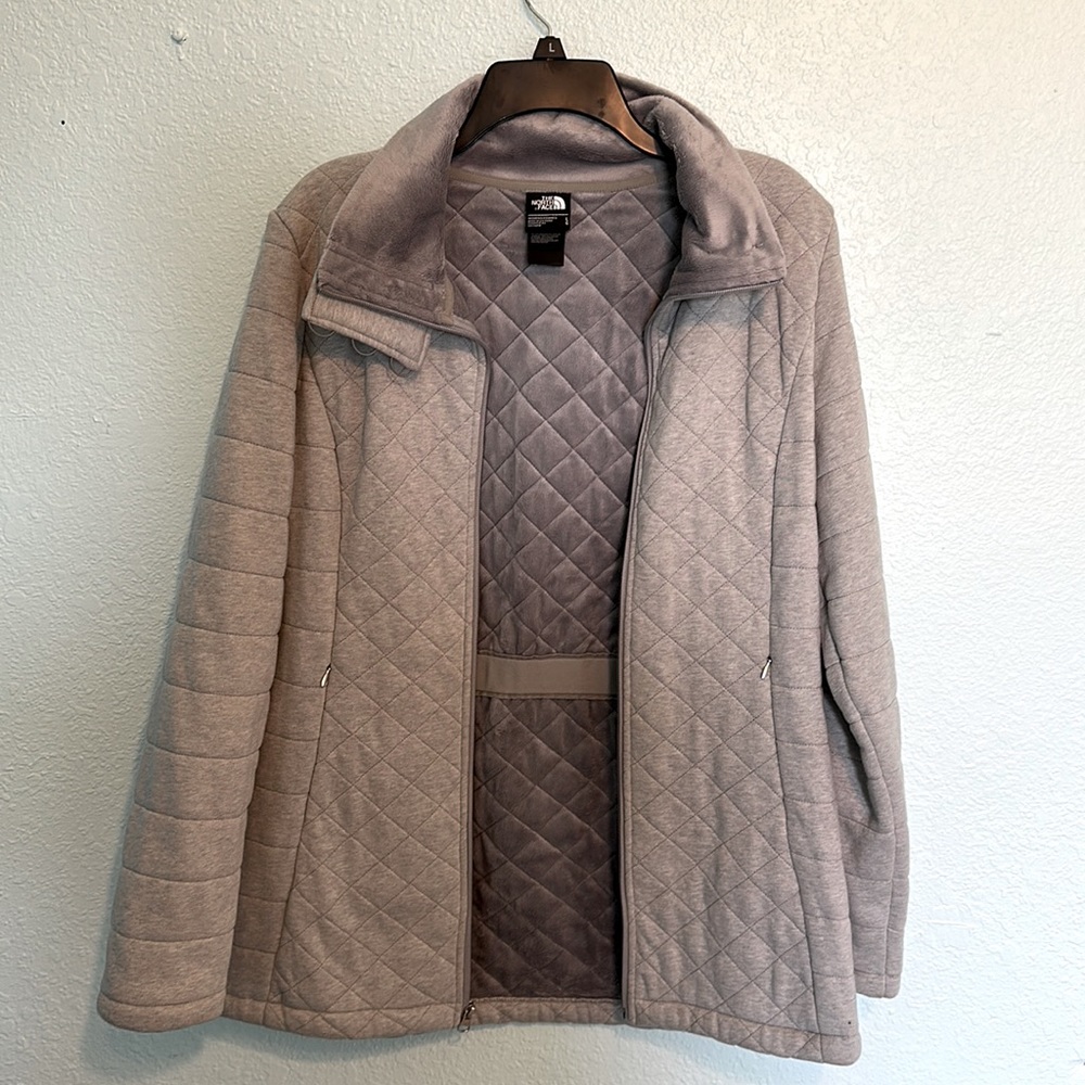 The North Face size Large gray quilted jacket.